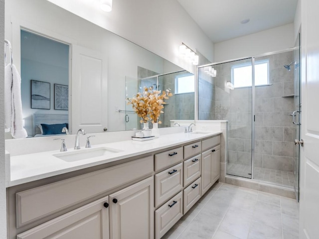 bathroom with vanity, tile patterned floors, and an enclosed shower