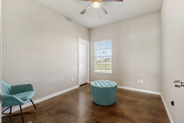 living area featuring ceiling fan