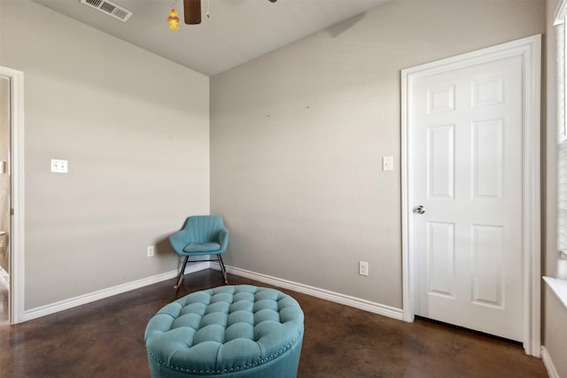 sitting room featuring ceiling fan