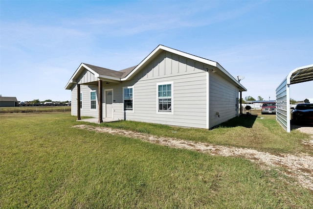 rear view of house with a lawn