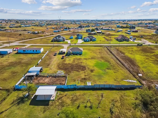 birds eye view of property with a rural view