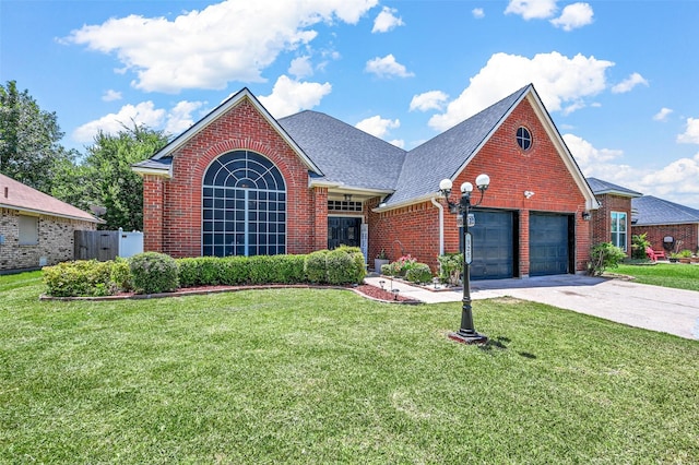 view of front property with a garage and a front yard