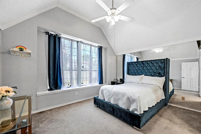 carpeted bedroom with ceiling fan, crown molding, and lofted ceiling