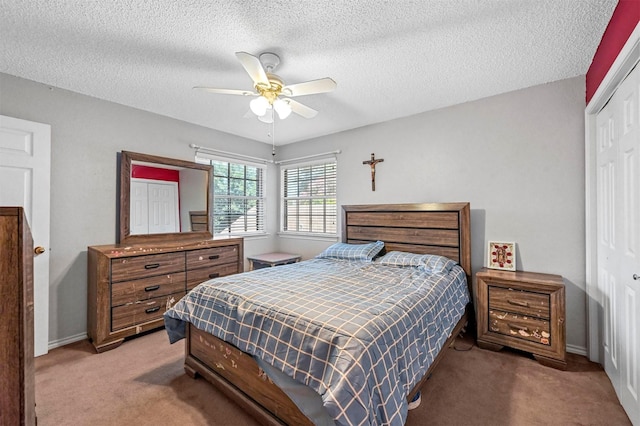 bedroom featuring carpet flooring, ceiling fan, and a closet