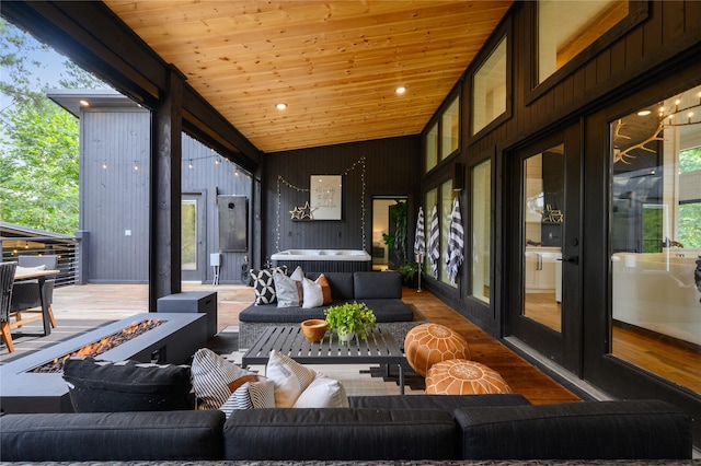 view of patio / terrace featuring an outdoor living space with a fire pit and french doors