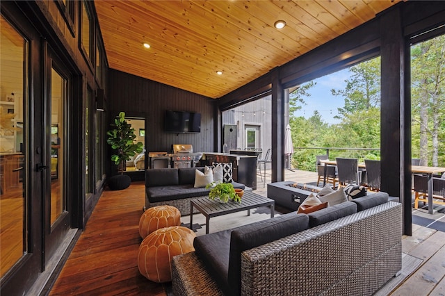 sunroom / solarium with wood ceiling and vaulted ceiling