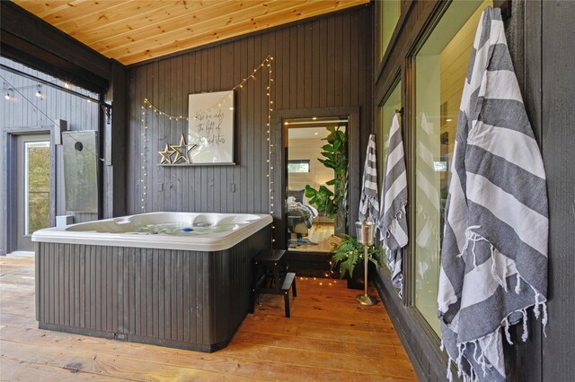 exterior space featuring wooden ceiling and a jacuzzi