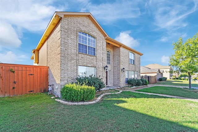 view of side of home with a lawn