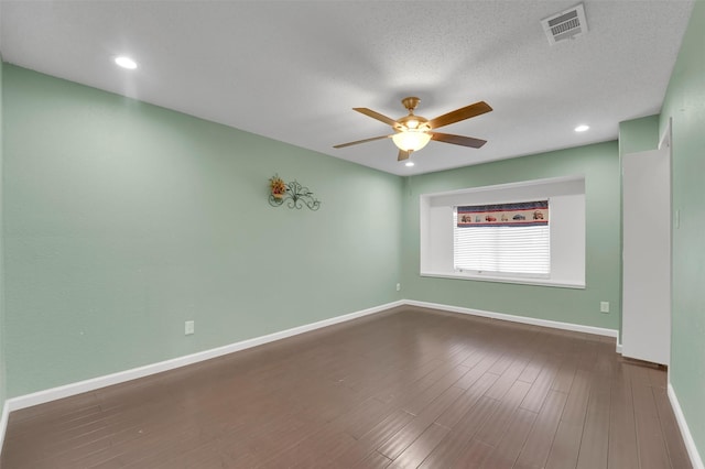 empty room featuring wood-type flooring, a textured ceiling, and ceiling fan