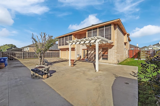 view of front facade featuring a sunroom, a pergola, and a patio