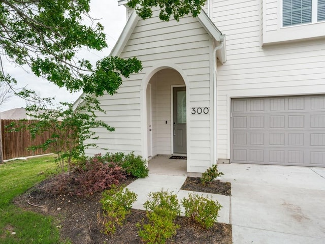 doorway to property featuring a garage