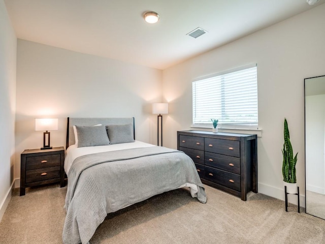 bedroom with light carpet