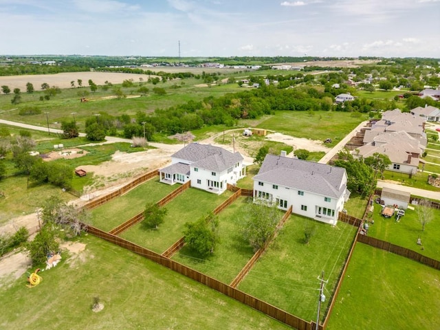 birds eye view of property with a rural view