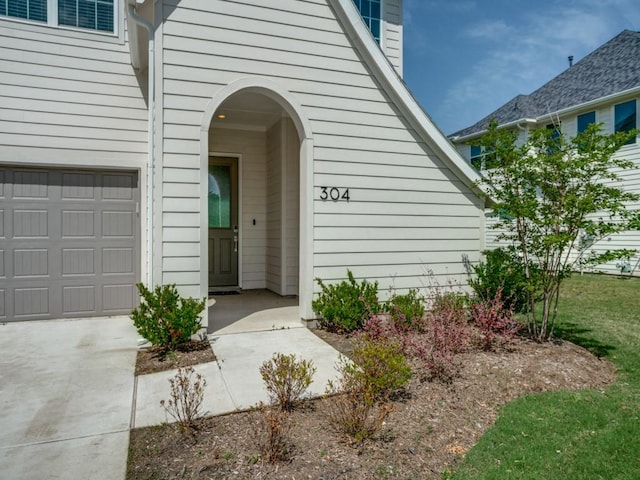 property entrance with a garage