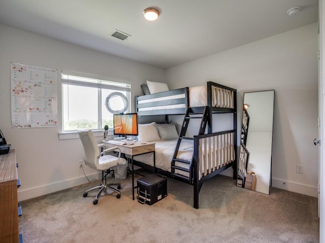 bedroom featuring light colored carpet