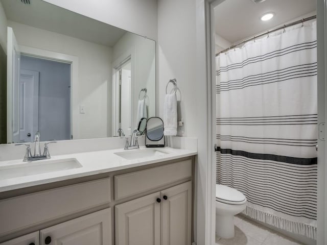 bathroom featuring tile patterned flooring, vanity, toilet, and a shower with shower curtain