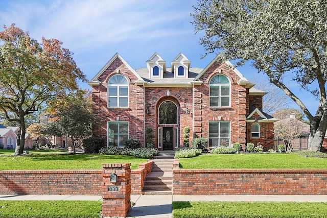 view of front of home with a front lawn