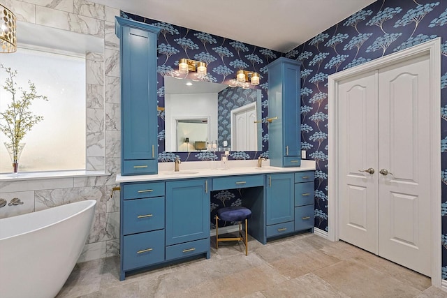 bathroom featuring vanity and a bathing tub