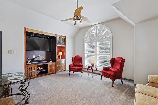 sitting room featuring vaulted ceiling, carpet, and ceiling fan