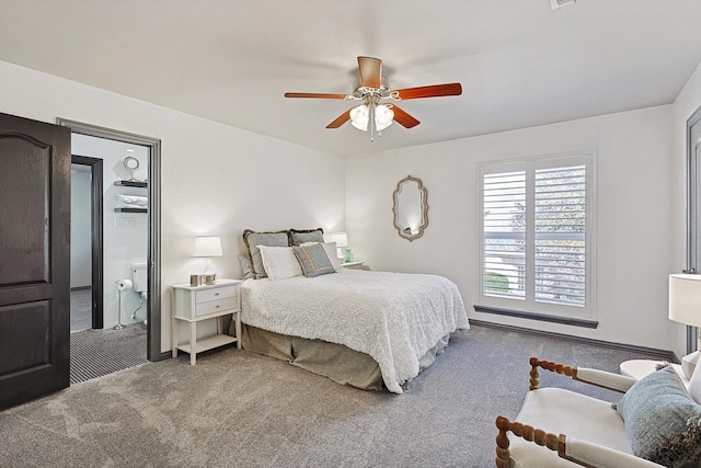 carpeted bedroom featuring a baseboard heating unit and ceiling fan