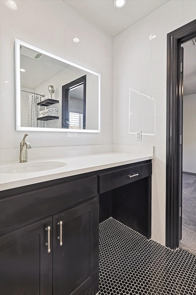 bathroom featuring vanity and a shower with shower curtain