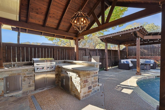 view of patio with outdoor lounge area, exterior kitchen, an outdoor wet bar, grilling area, and a gazebo