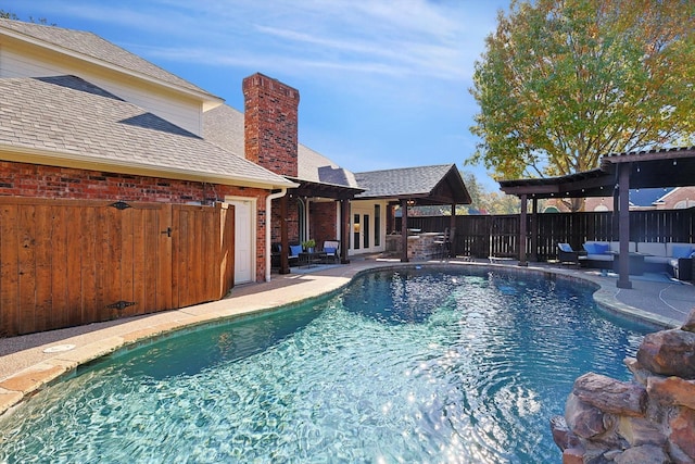 view of swimming pool with an outdoor living space and a patio