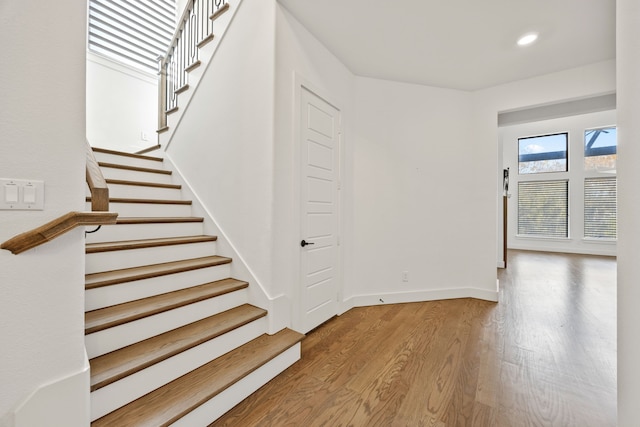 staircase featuring hardwood / wood-style floors