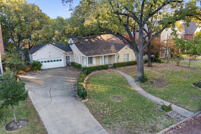 ranch-style house with stone siding, driveway, a front yard, and a garage