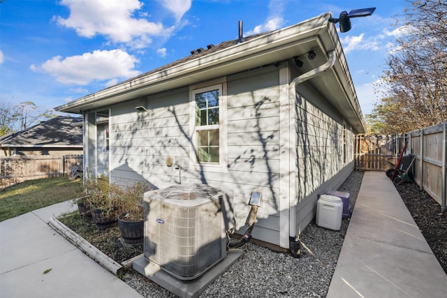 view of home's exterior with cooling unit