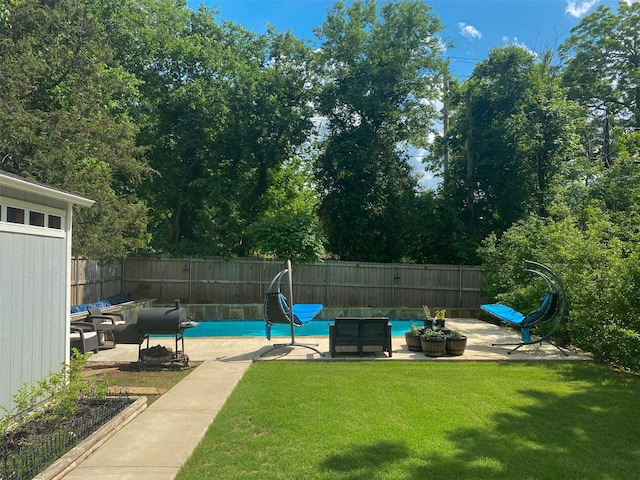 view of swimming pool with a yard, an outdoor living space, and a patio