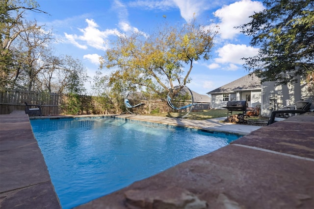 view of swimming pool featuring a patio