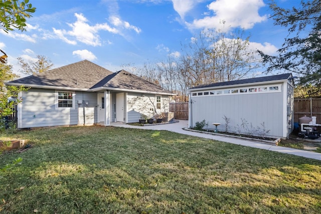 view of front of property with a garage and a front yard