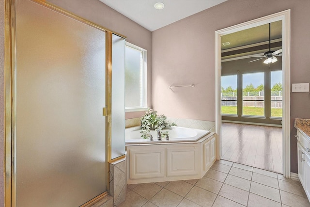 bathroom with separate shower and tub, ceiling fan, tile patterned flooring, and vanity