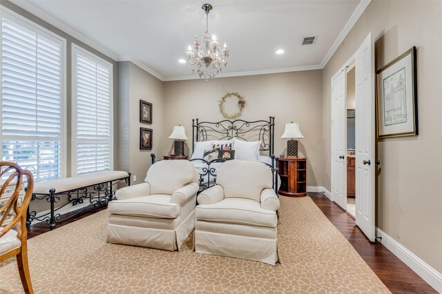 bedroom with dark hardwood / wood-style flooring, ornamental molding, and a chandelier