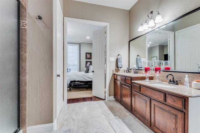 bathroom with vanity and ornamental molding