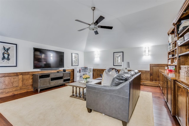 living room featuring ceiling fan, hardwood / wood-style floors, and lofted ceiling