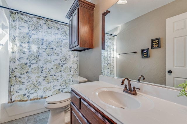 full bathroom with tile patterned floors, vanity, toilet, and shower / bath combo with shower curtain