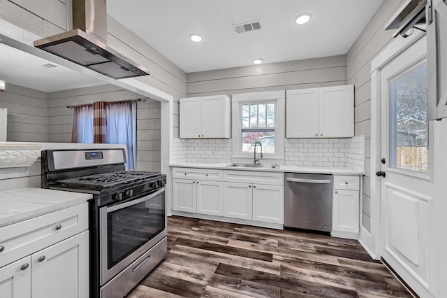 kitchen featuring white cabinetry, sink, dark hardwood / wood-style floors, and appliances with stainless steel finishes