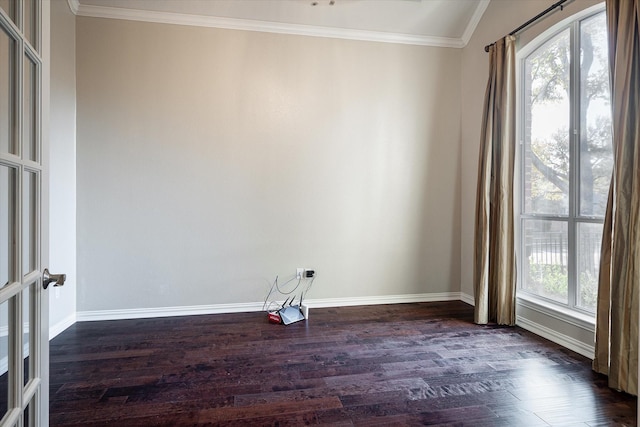 spare room featuring ornamental molding, vaulted ceiling, and dark wood-type flooring