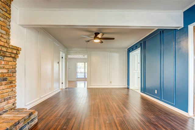 unfurnished living room featuring ceiling fan, dark hardwood / wood-style flooring, and ornamental molding