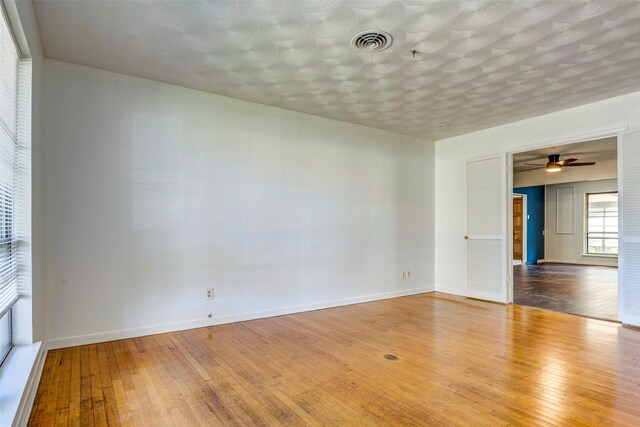 empty room with hardwood / wood-style floors