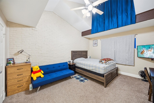 carpeted bedroom featuring ceiling fan, brick wall, and vaulted ceiling