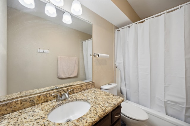 bathroom with vanity, toilet, and walk in shower