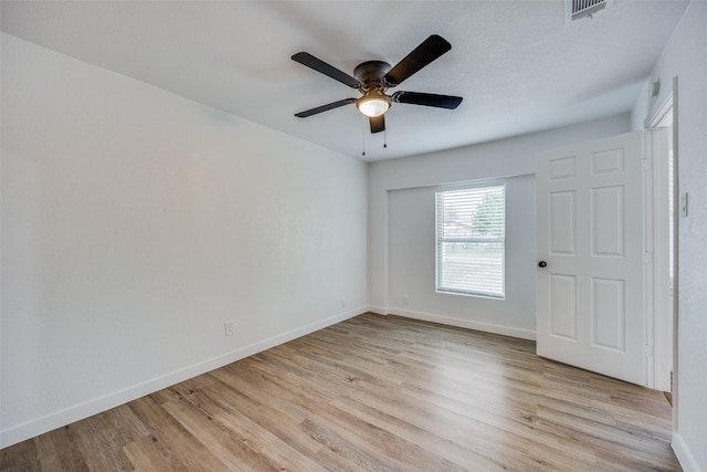 unfurnished room with ceiling fan and light hardwood / wood-style floors