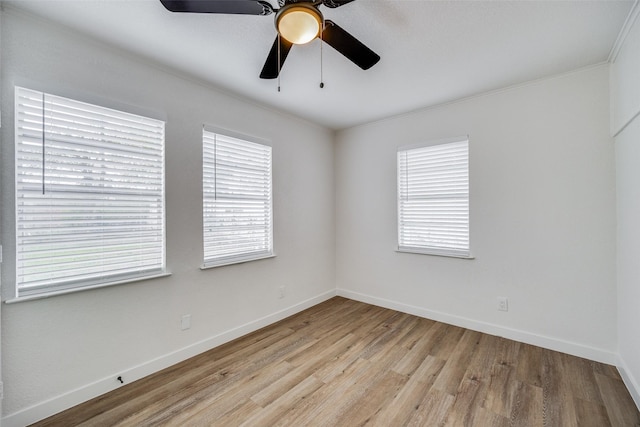 spare room featuring crown molding, ceiling fan, and light hardwood / wood-style floors