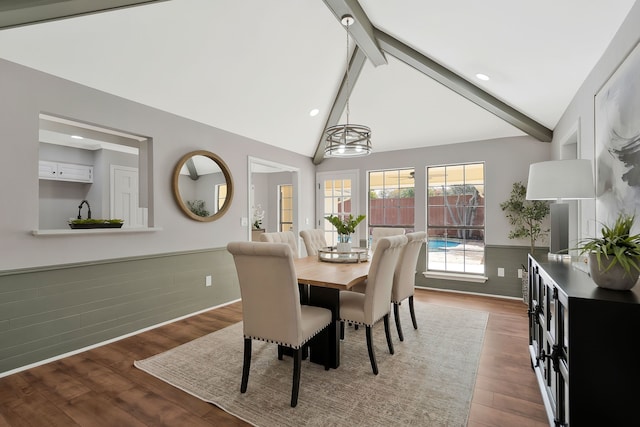 dining room featuring beam ceiling, high vaulted ceiling, a notable chandelier, and hardwood / wood-style flooring