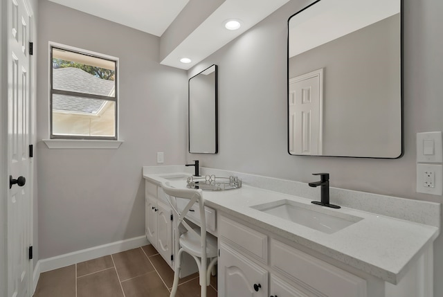 bathroom featuring tile patterned flooring and vanity