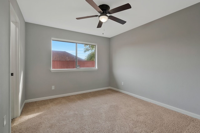 empty room with carpet and ceiling fan