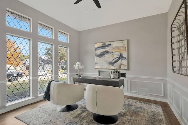 home office featuring hardwood / wood-style floors, plenty of natural light, and ceiling fan